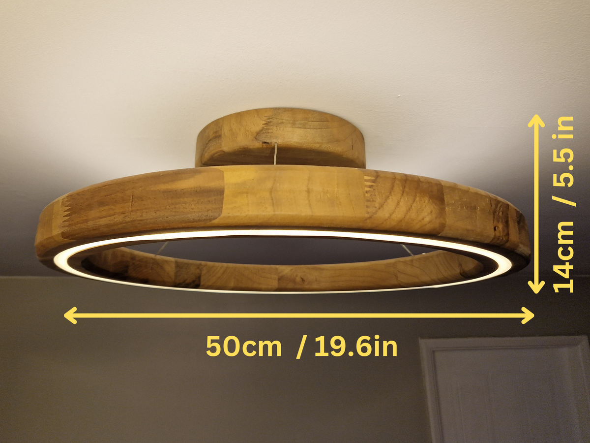 A circular wooden ceiling light fixture with a glowing white LED ring, shown installed on a ceiling with yellow dimension arrows and text indicating 50cm width and 14cm height.