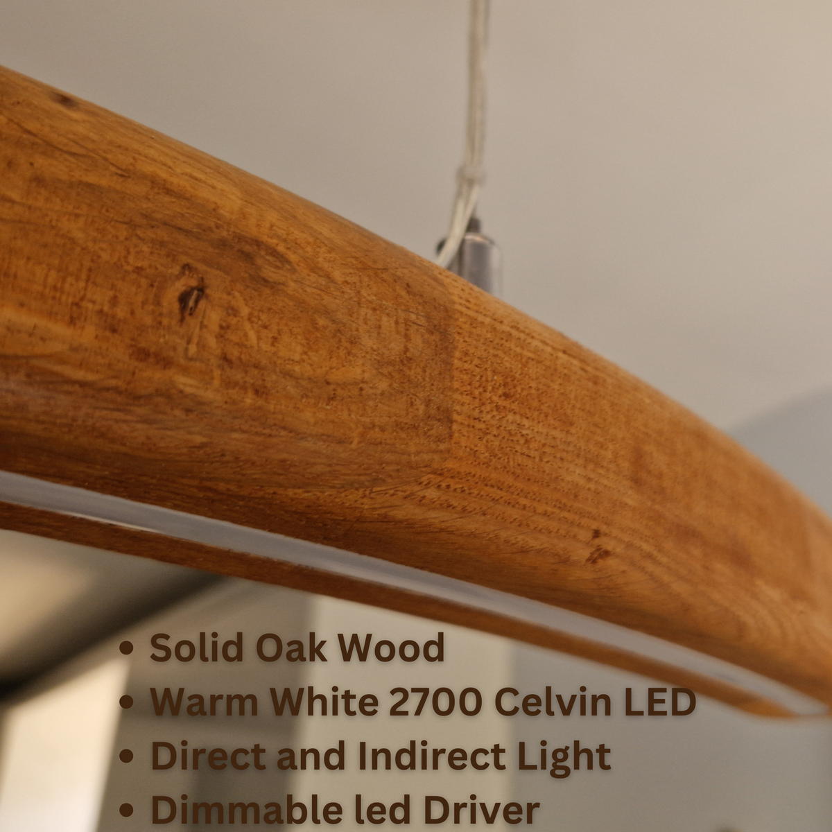 Close-up of a curved solid oak wood light fixture bar with a warm white LED light underneath, featuring text overlays detailing product features.