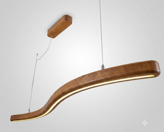 A modern curved wooden pendant light with a warm glowing LED strip, suspended by thin cables from a ceiling mount against a light gray background.