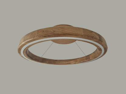 A modern circular LED ceiling light fixture with a natural wood outer ring and a white inner accent ring, suspended by thin cables against a solid gray background.